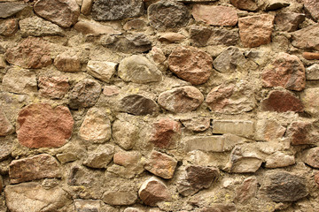Antique brown textured old stone wall background
