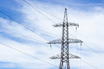 Power Tower. High voltage lines and power pylons. High voltage power lines installing on high electric post connected