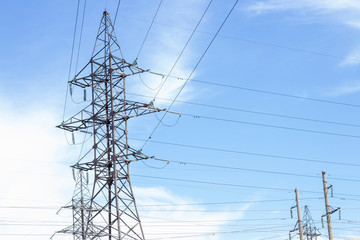 Power Tower. High voltage lines and power pylons. High voltage power lines installing on high electric post connected