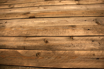 Obraz premium Dark rustic brown wood uneven planks background