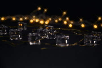 ice cubes with a party lights background