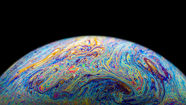 Macro picture of half soap bubble look like planet in space
