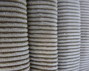Rolled rolls column columns corduroy velvet clothing fabric textile textures material surface texture stripes pattern background