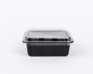 Black Plastic food box package isolated on white background.