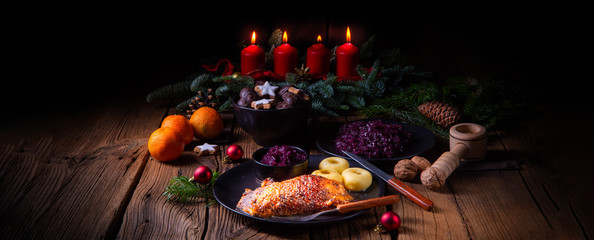 Roast goose with baked apples, red cabbage and dumplings