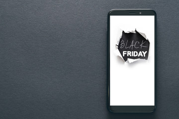 Black friday sale. Online shopping application. Smartphone screen. Dark background.