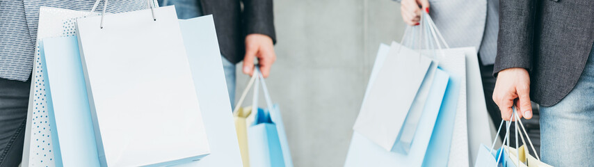 Shopping obsession. Black friday sale discount. People with paper bags. Brand mockup.