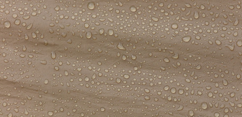 Raindrops on a tent as an abstract background
