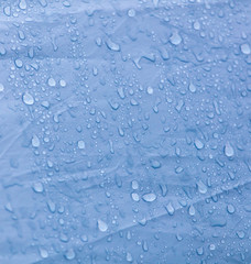 Raindrops on a tent as an abstract background