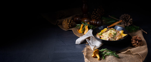 Colorful farfalle pasta with chanterelles and cream sauce.