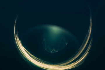 Blur lens flare. Teal blue abstract art background. Yellow strokes glow. Crescent moon design.