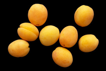Ripe apricot on a black background