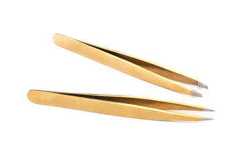 Two metal tweezers for styling eyebrows on a white isolated background