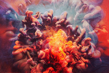 Ink water splash. Fantasy bonfire. Orange fume. Abstract art background.