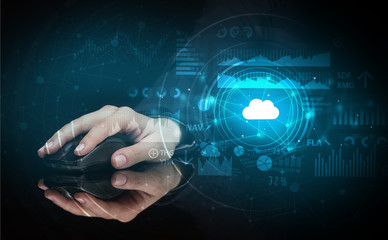 Hand using wireless mouse with cloud technology concept and dark background