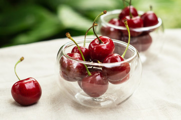 Red cherries in glass plates