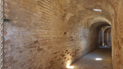 Vault in the splendid amphitheater, part of archaeological ensemble of Italica, city with a strategic role in the Roman Empire, birthplace of Emperors Trajan and Hadrian, in Santiponce, Seville, Spain