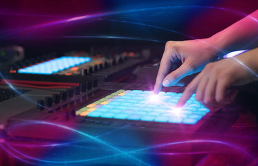 Hand mixing music on midi controller with wave vibe concept