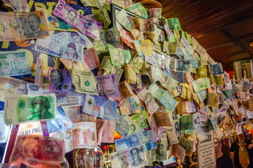 Colourful collection of multiple currency from different country with symbol and pictures on the notes - Powered by Adobe