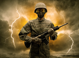 Armed soldier standing in rainy obscure weather