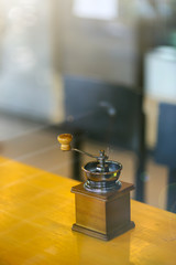 Manual coffee grinder for grinding coffee beans.