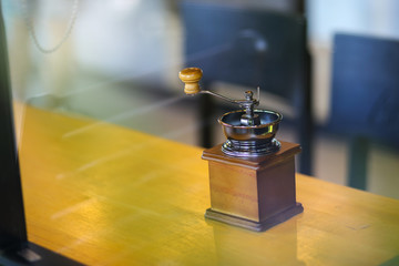 Manual coffee grinder for grinding coffee beans.