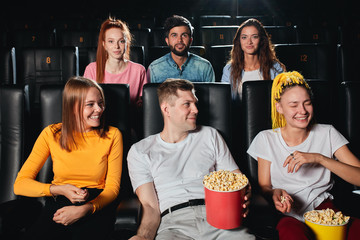 young people looking at their friend with dreads as she is laughing very loudly during the session. close up photo.habit , art