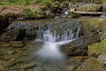 Fototapeta na wymiar Small waterfall on the mounatin creek of La Gafe