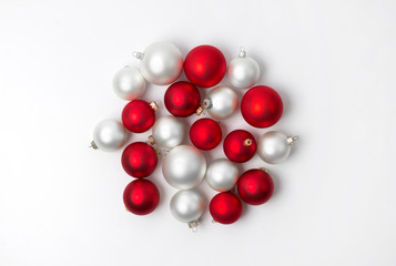 Red and white matte Christmas baubles decoration on white background with copy space