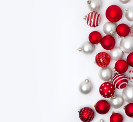 Red and white matte Christmas baubles decoration on white background with copy space