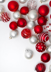 Red and white matte Christmas baubles decoration on white background with copy space