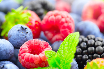Fototapeta na wymiar Berries. Various colorful berries background. Strawberry, raspberry, blackberry, blueberry closeup. Healthy eating