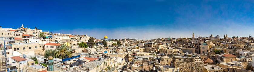 Fototapeta na wymiar Panoramic view of Muslim quarter and The Dome of the Rock Qubbat al-Sakhrah from the wall in the Old City of Jerusalem, Israel. Stitched panorama.