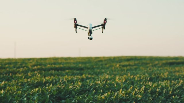 Smart agriculture drone flying in sky rural aerial helicopter agros copter farm farming field industry landscape meadow nature plant professional vehicle aircraft harvest innovation slow motion