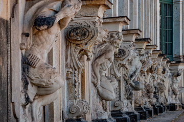 Row of old mythological and religious statues in the Zwinger palace and garden in downtown of...