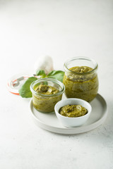 Homemade pesto sauce in jars