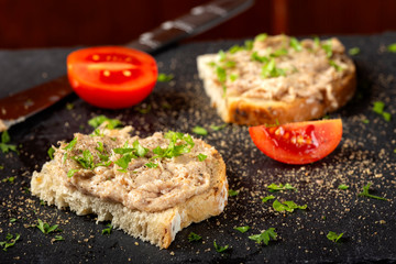 Bread with pork pate and ground black pepper