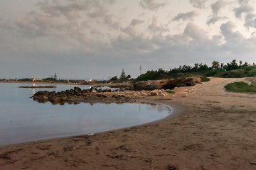 Shot of the Cirica Bay at sunrise. Cirica is a beautiful nature seaside place made of cliffs, rocks and sand in the southern Sicily, Italy	