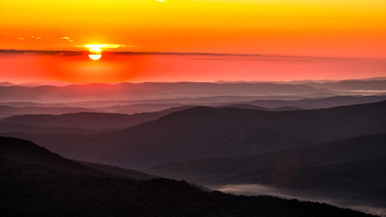 Silhouettes of the mountains at sunrise. Bieszczady National Park. Poland
