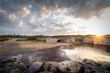 Shot of the Cirica Bay at sunrise. Cirica is a beautiful nature seaside place made of cliffs, rocks and sand in the southern Sicily, Italy