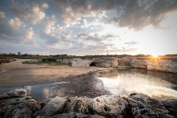 Shot of the Cirica Bay at sunrise. Cirica is a beautiful nature seaside place made of cliffs, rocks and sand in the southern Sicily, Italy