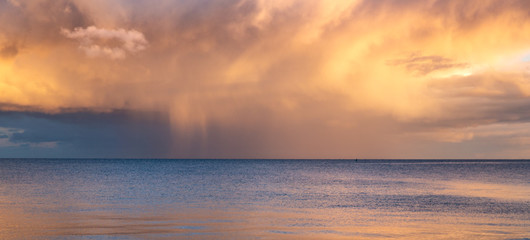 Naklejka na ściany i meble Storm clouds at sunset, Douglas bay, Isle of Man, British Isles