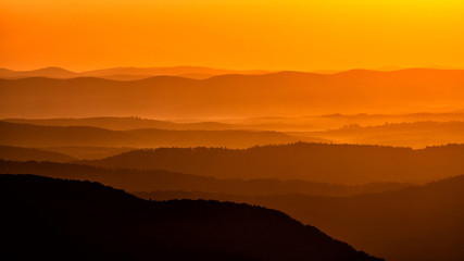 Silhouettes of the mountains at sunrise. Bieszczady National Park. Poland