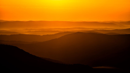 Silhouettes of the mountains at sunrise. Bieszczady National Park. Poland