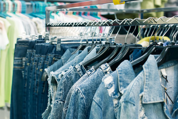 Showcase with denim clothes in a fashion store on sale