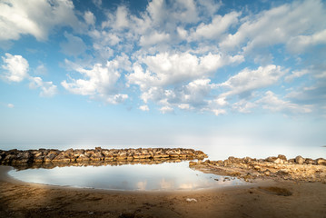 Shot of the Cirica Bay at sunrise. Cirica is a beautiful nature seaside place made of cliffs, rocks and sand in the southern Sicily, Italy