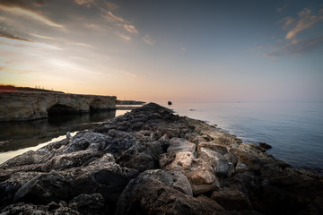 Shot of the Cirica Bay at sunrise. Cirica is a beautiful nature seaside place made of cliffs, rocks and sand in the southern Sicily, Italy