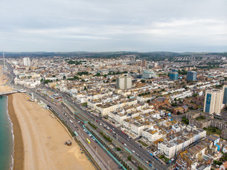 Aerial photo of the Brighton beach and coastal area located in the south coast of England UK that is part of the City of Brighton and Hove, taken on a bright sunny day