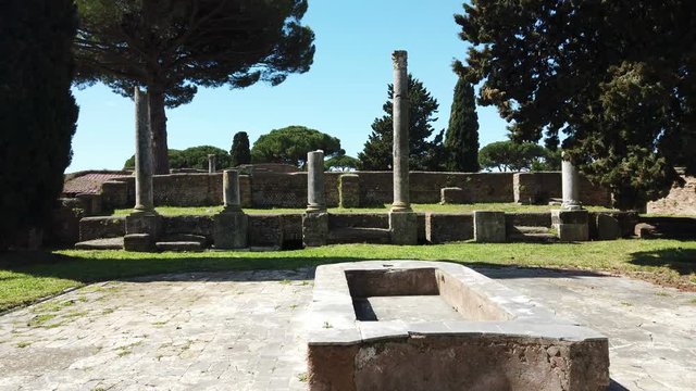 A look at the beautiful Roman ruins in the archaeological excavations of Ostia Antica, with impluvium, Roman colonnades and remains of buildings