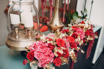 Wedding decor with vase and red flowers roses